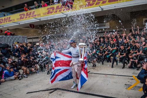 Lewis Hamilton celebrates winning the driver's championship at the 2015 Formual 1 race. 