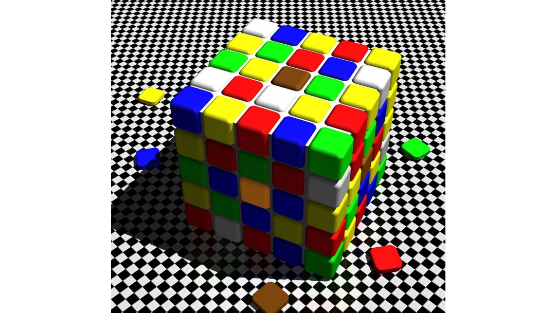 A cube, with 25 colored squares on each side in a five by five grid.