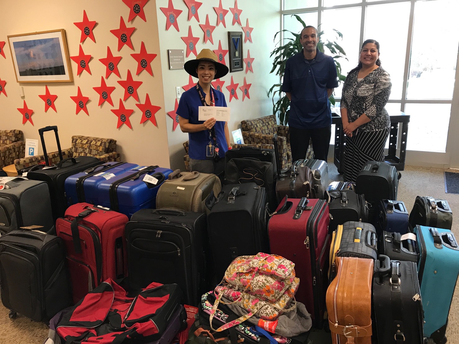 ACC Support Center representatives dropped off donations received during the 2019 Luggage Drive. 
