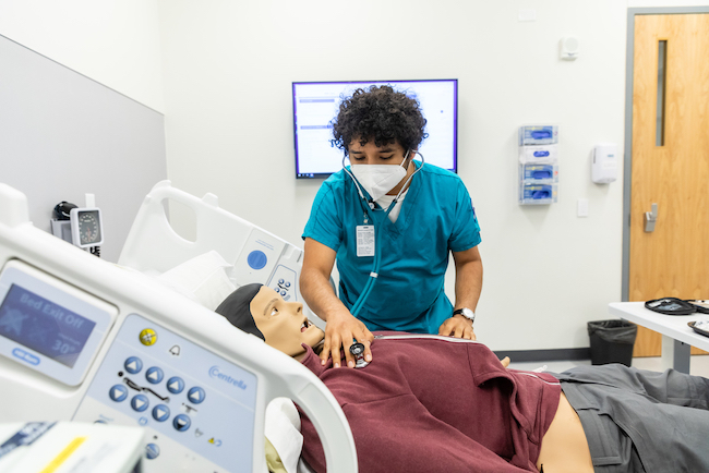 ACC first semester nursing students rehearse practical skills scenarios under the guidance of their instructor on Friday, November 12, 2021, inside the ACC Health Science Regional Simulation Center at the Highland Campus.
