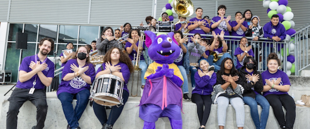 R.B. the Riverbat at ACC Highland paseo with LBJ ECHS Marching Band