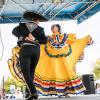 Ballet Folklorico dancers perform on stage at 11th annual Diez y Seis celebration at ACC Riverside.