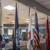 ACC Highland Veterans Resource Center flag display with military and national flags on flag poles. 