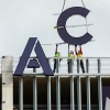A large letter A and C being installed on the East facing side of the Highland Campus parking garage.