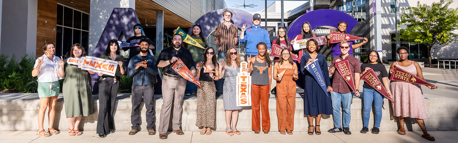 ACC Transfer students pose at the ACC Highland ACC letters landmark