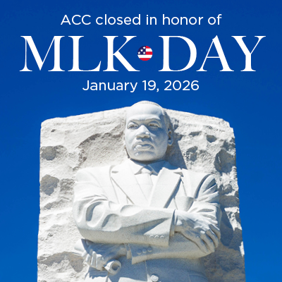 A closeup of a statue of Martin Luther King Jr against a blue background with the words ACC closed in the honor of MLK Day January 19 2026
