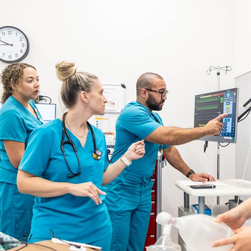 Medical professionals discussing in a healthcare environment.